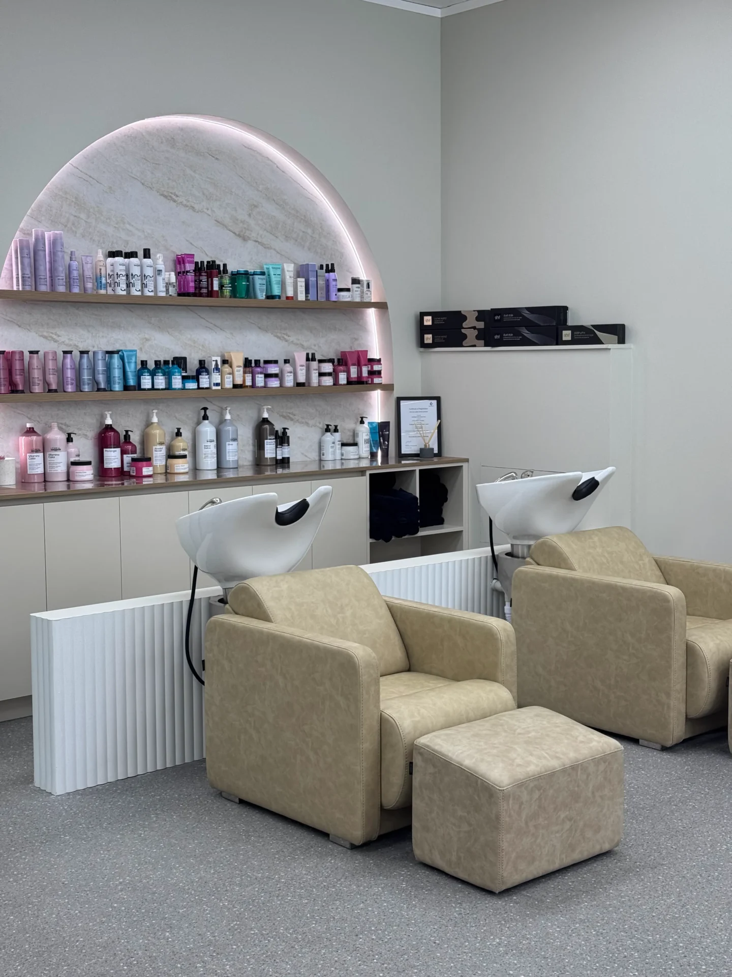 Modern salon with shampoo stations and products