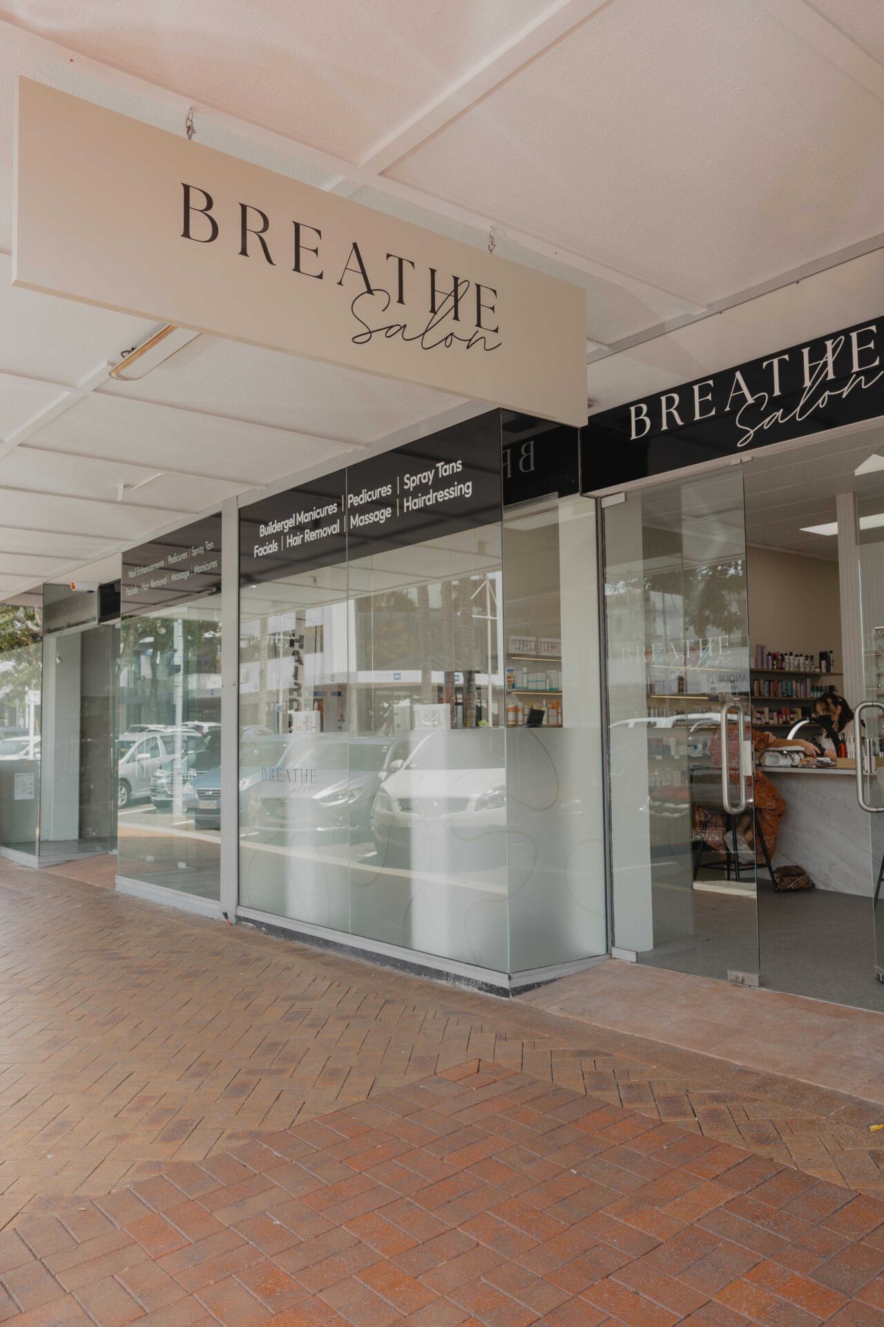 Breathe Salon exterior with glass storefront.