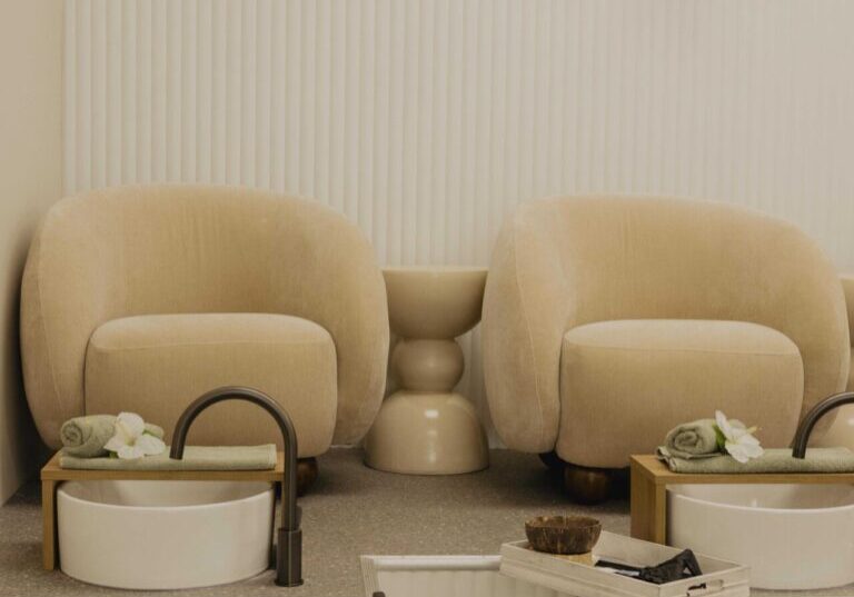 Luxurious pedicure station with comfy chairs.