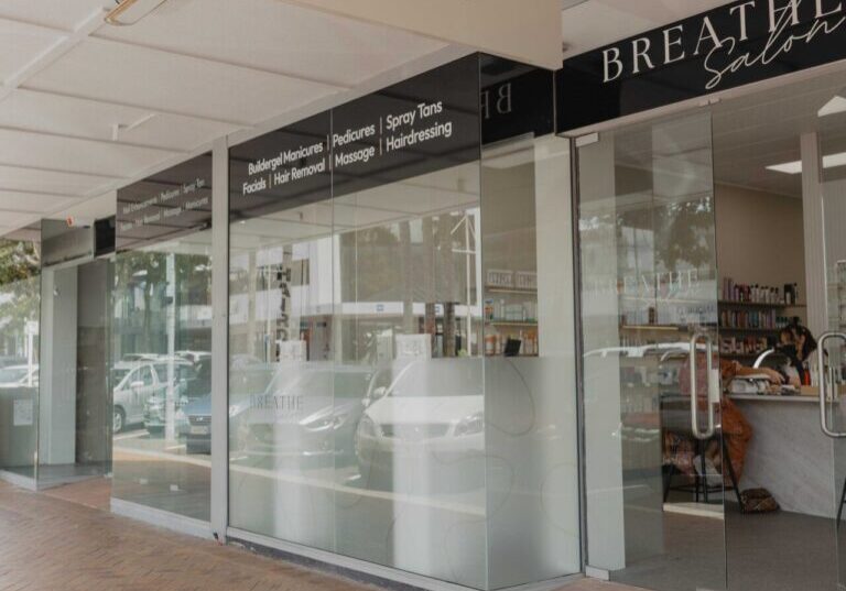 Breathe Salon exterior with glass storefront.