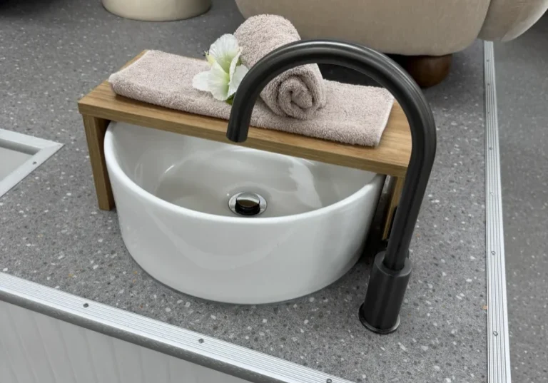 Spa-like foot bath setup with towel and flower